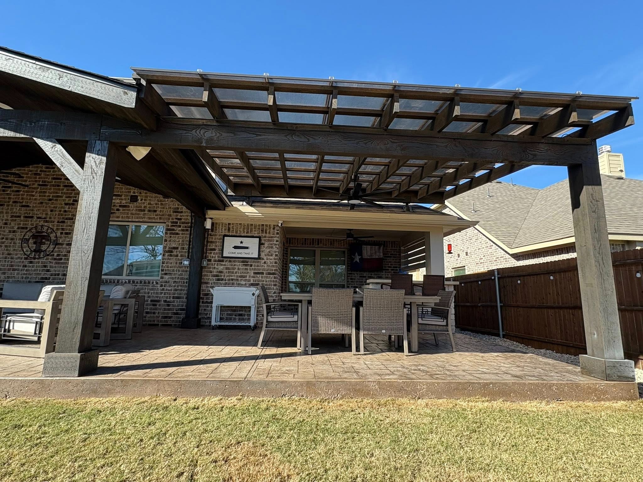Completed pergola with stamped concrete