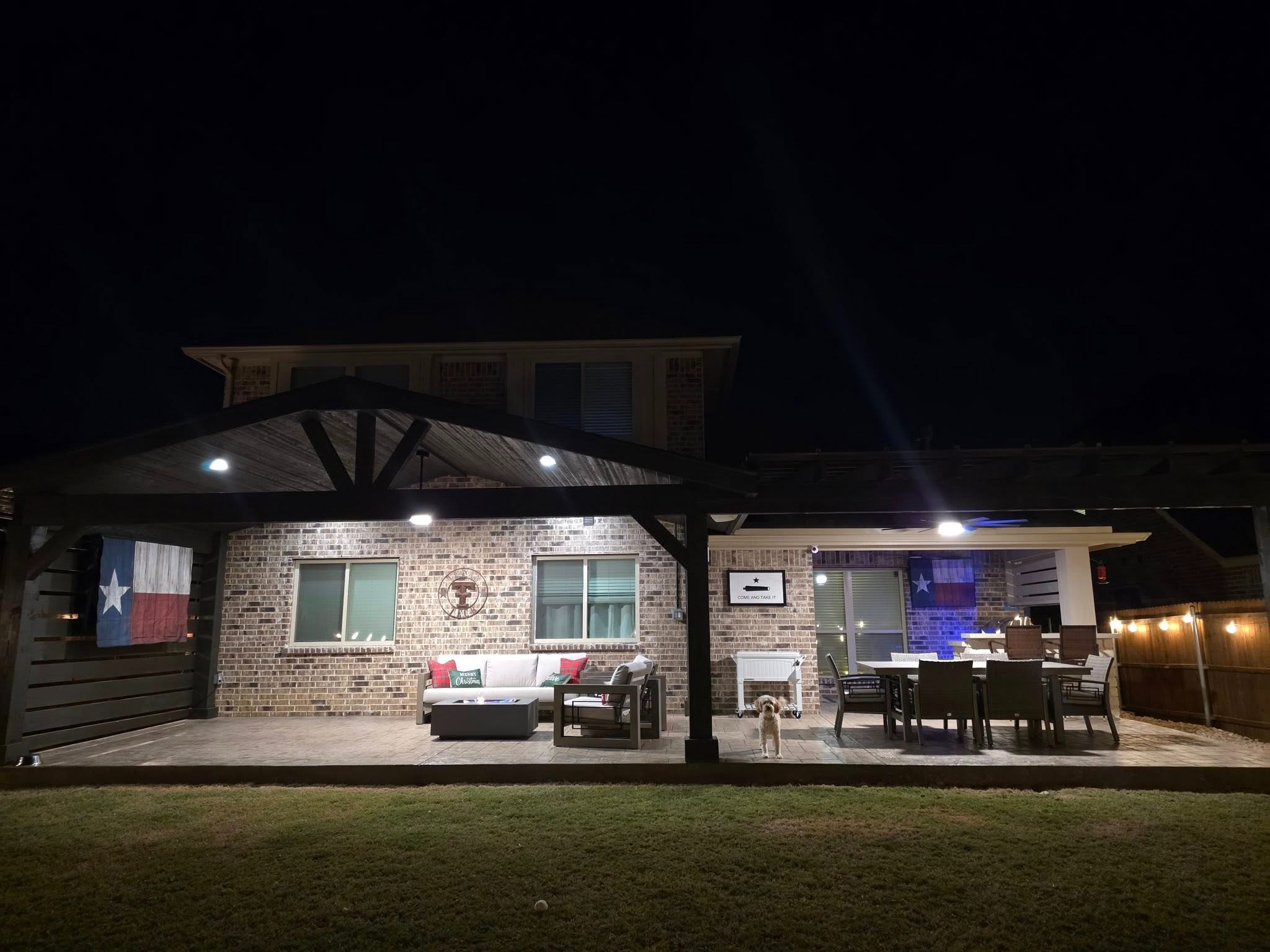 Complete outdoor kitchen and patio at night