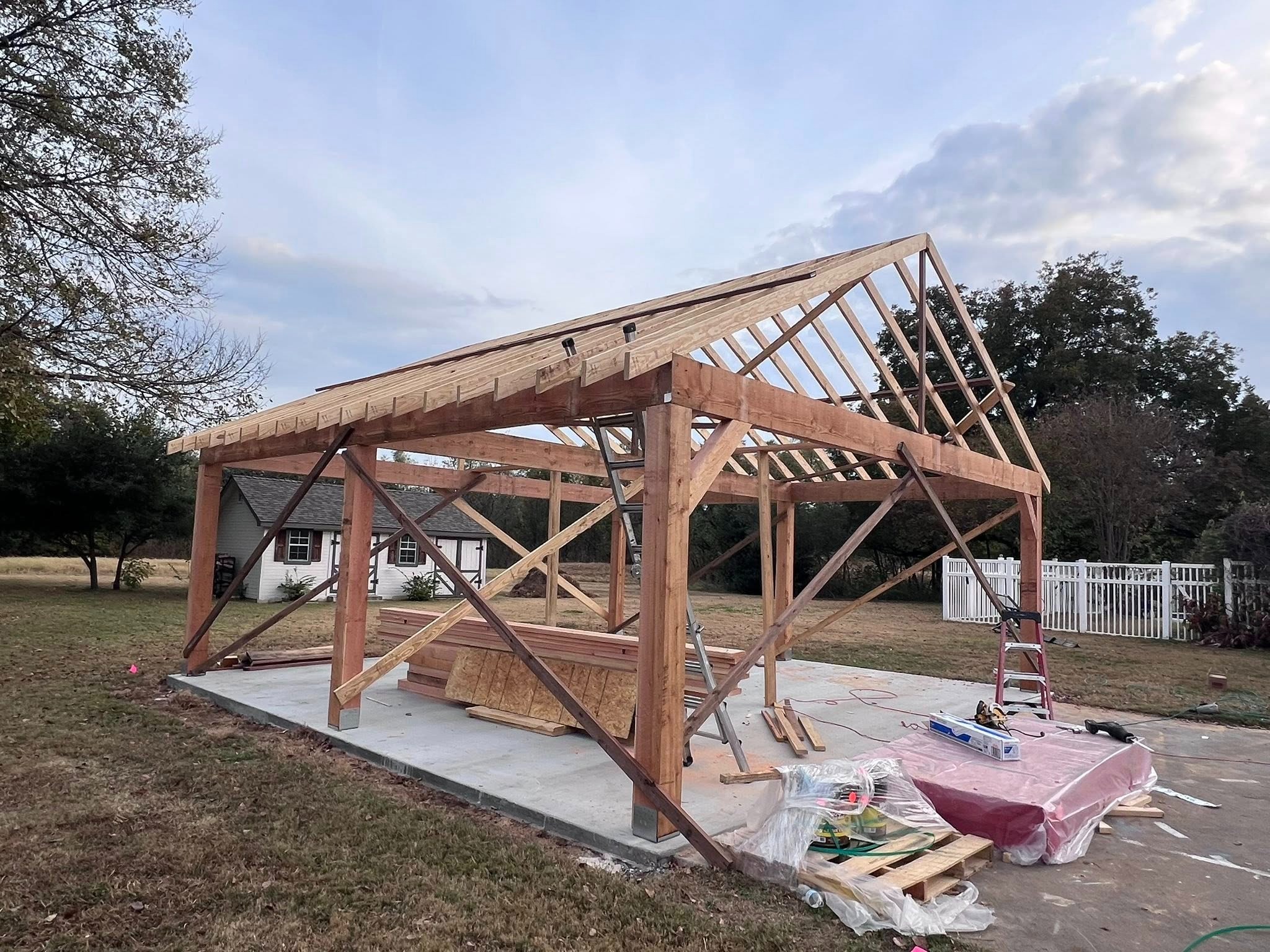 Framing stage — timber structure on concrete pad