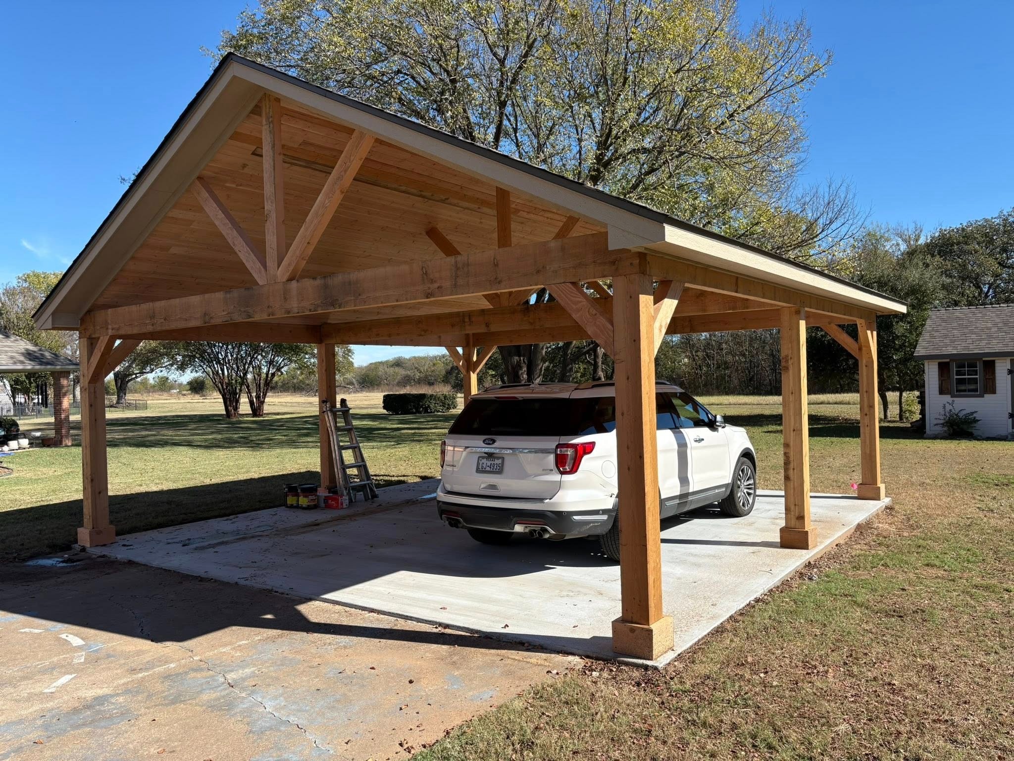 Finished carport with vehicle parked