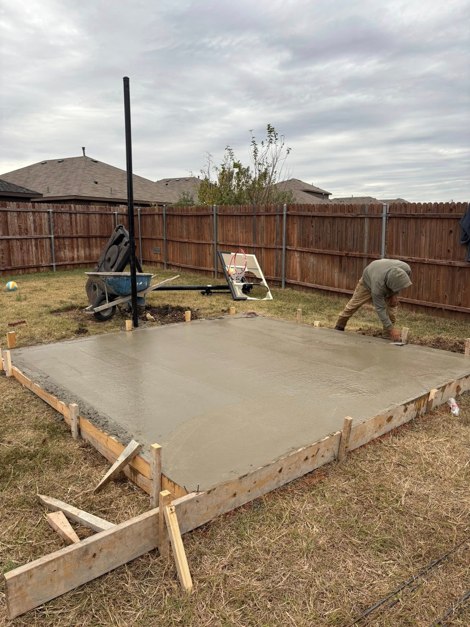 Concrete being poured and finished