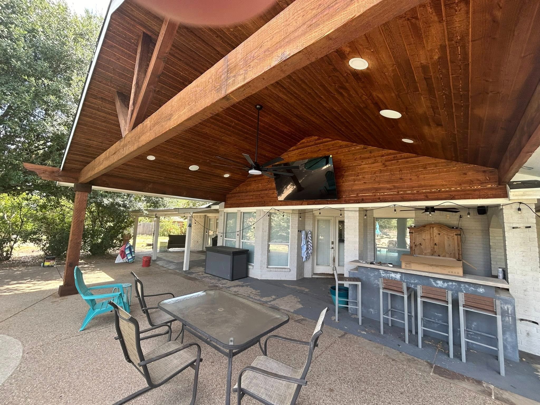 Wide angle interior — stained ceiling, bar, and seating