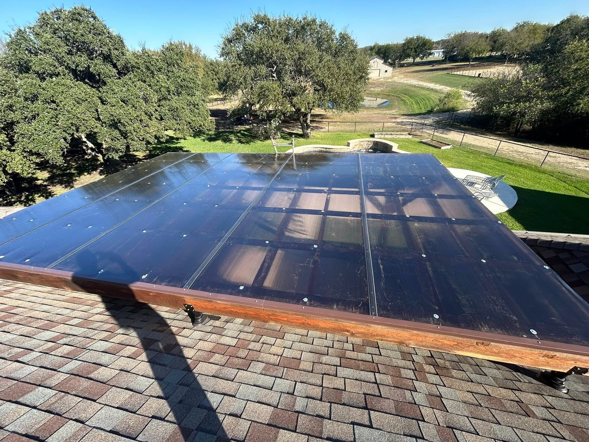 Solar panels with pool visible below