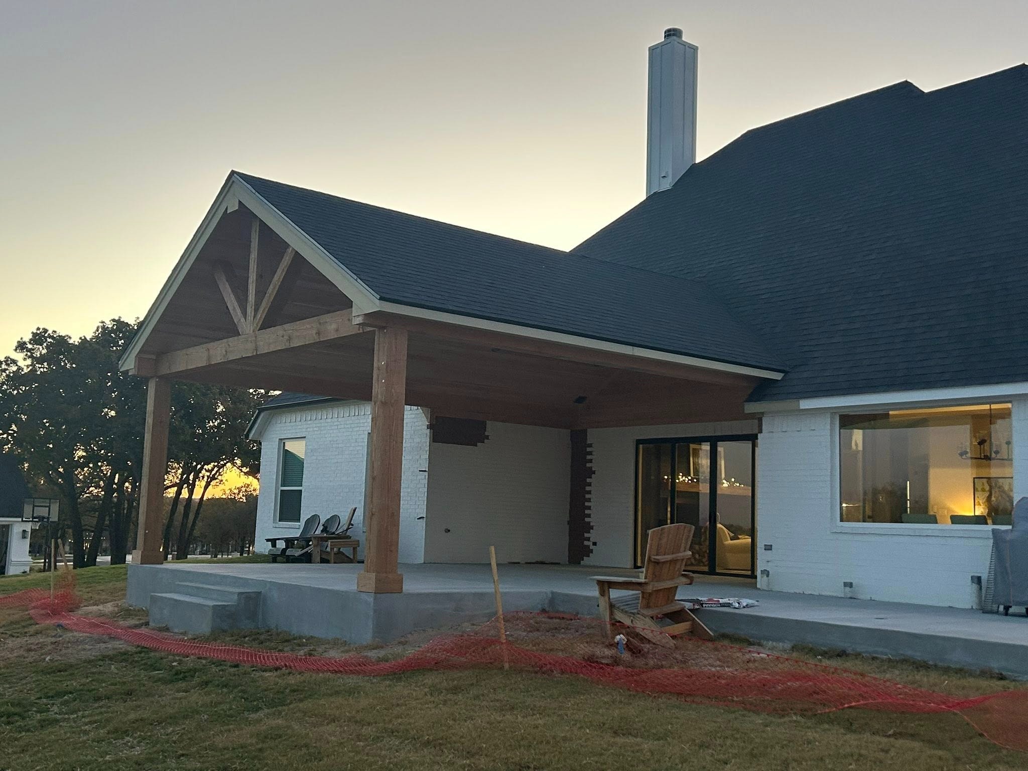 Exterior at dusk — unstained cedar frame