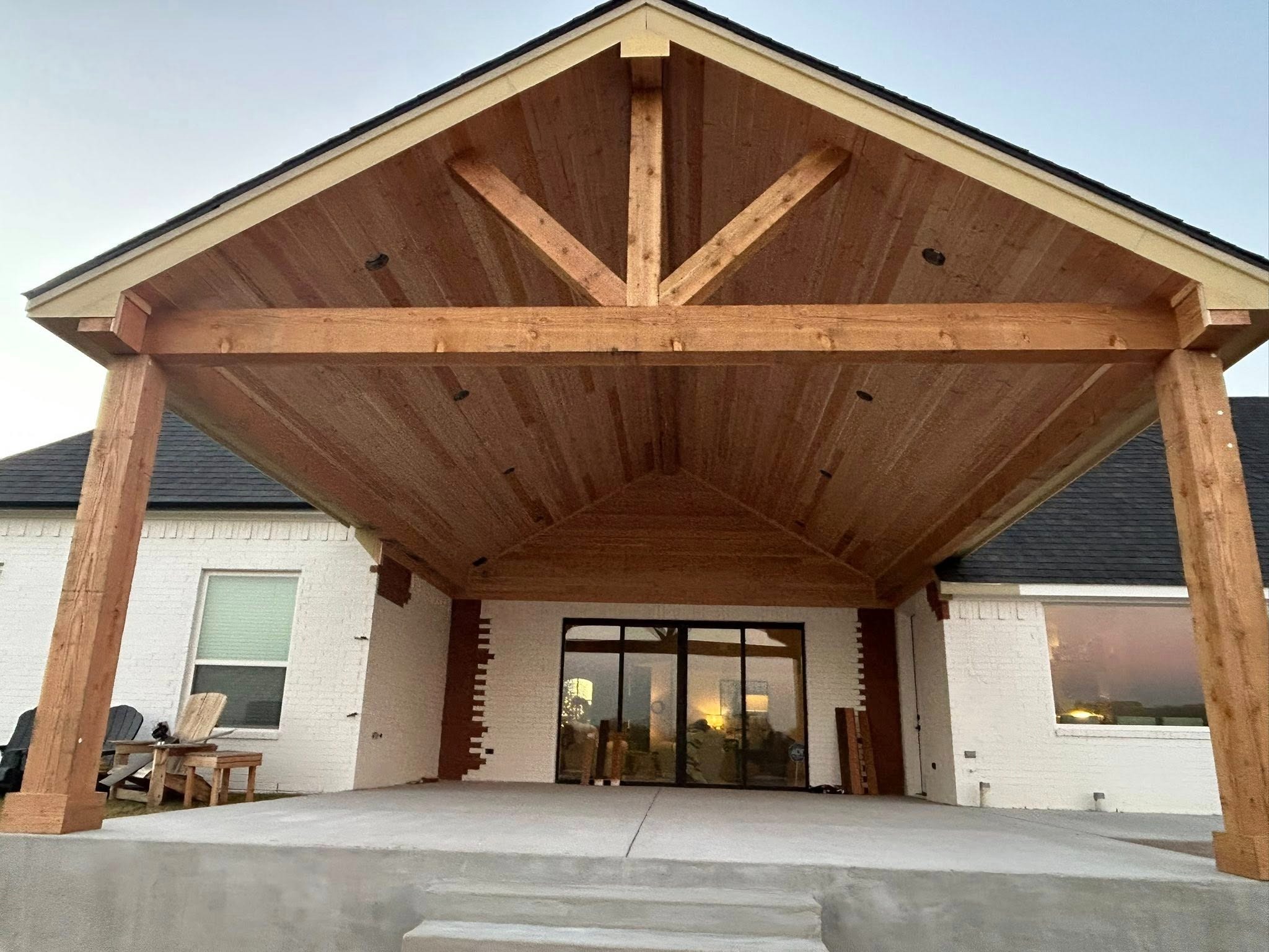 Front exterior — unstained gable with T&G ceiling