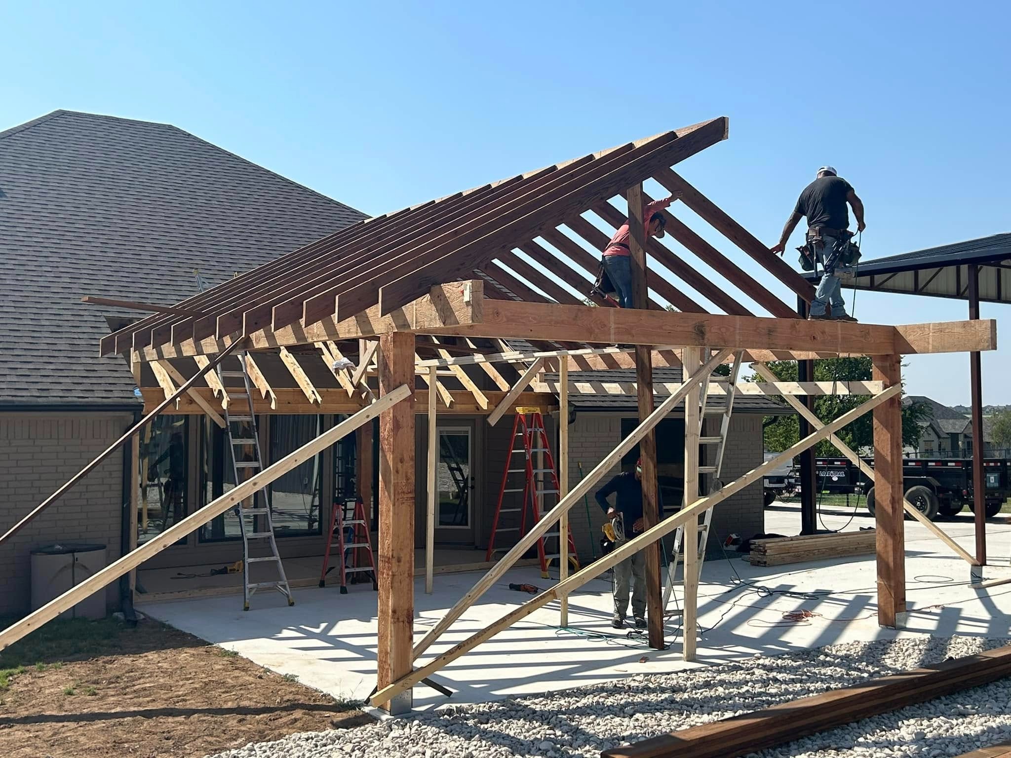 Framing stage — crew installing rafters