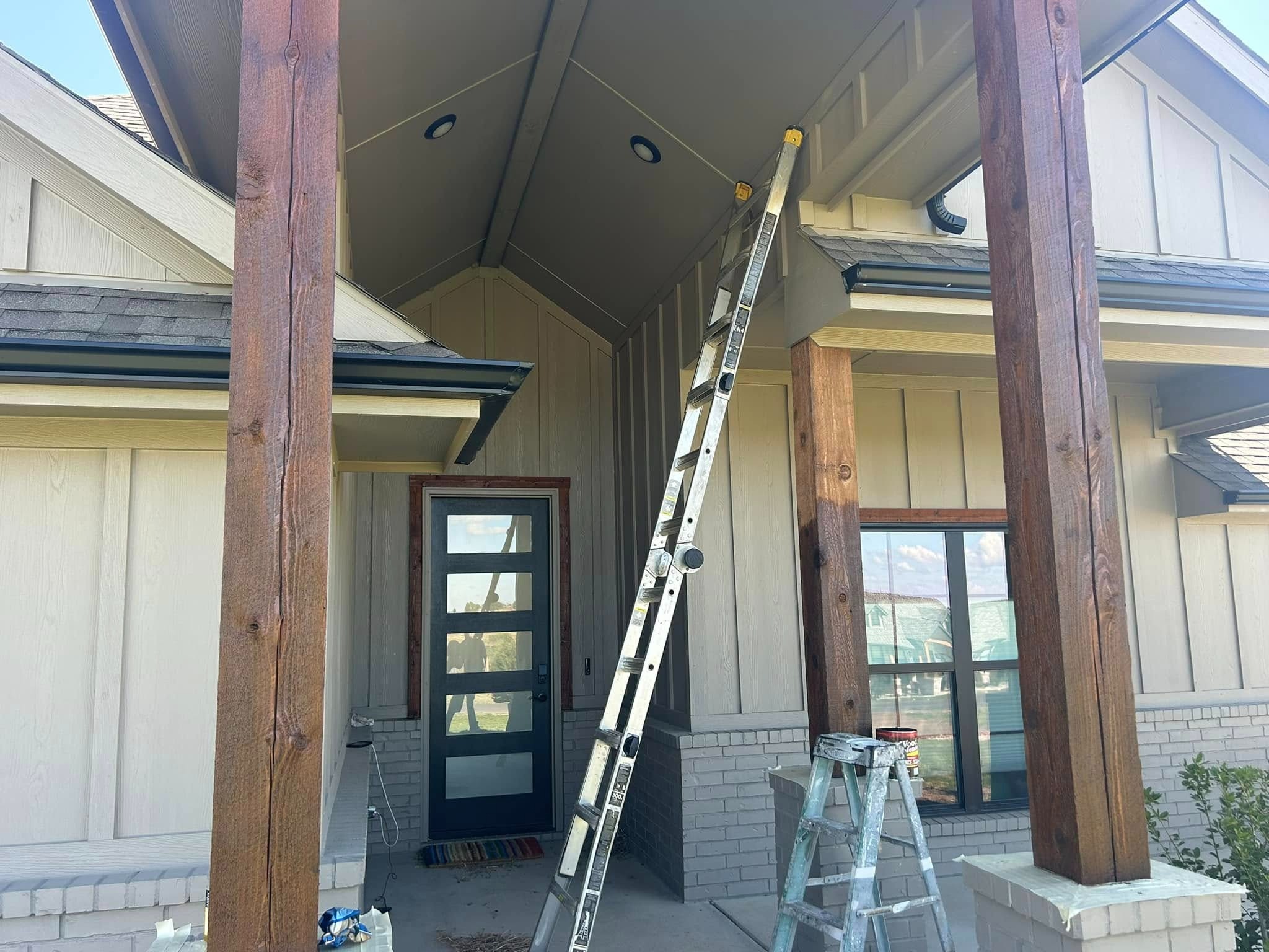 Front entry — stained cedar posts in progress