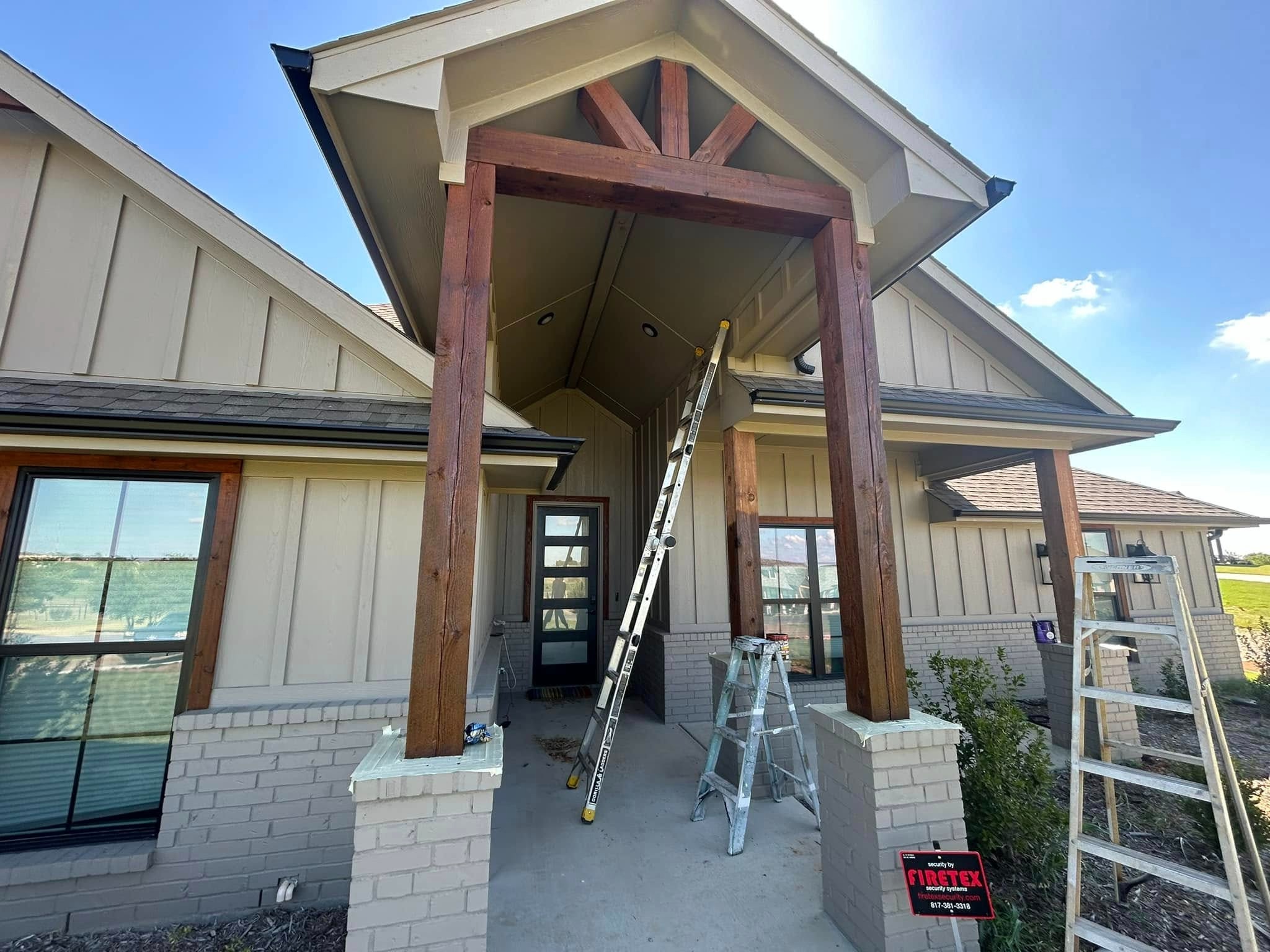 Front entry — stained cedar posts and gable