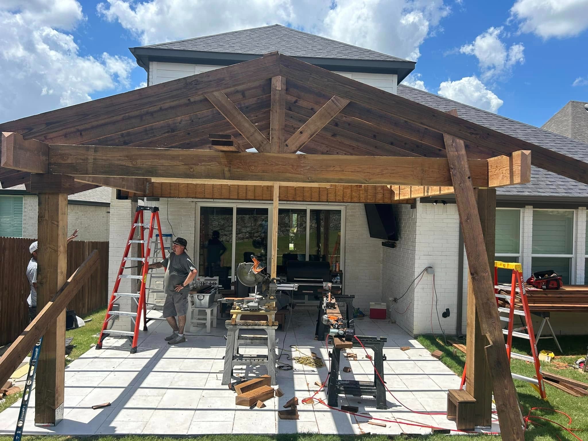 Gable patio cover with pergola extension under construction
